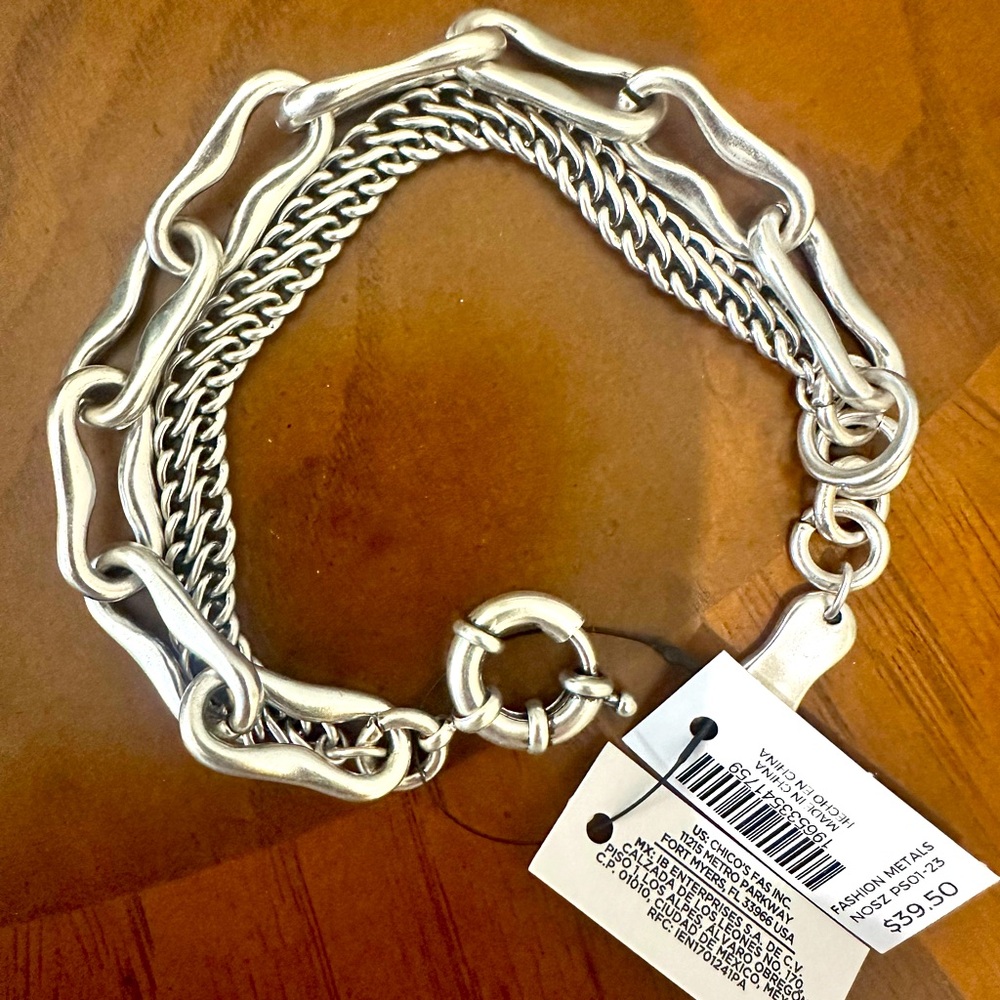 Multi string bracelet. Brushed silver metal. Adjustable. NWT